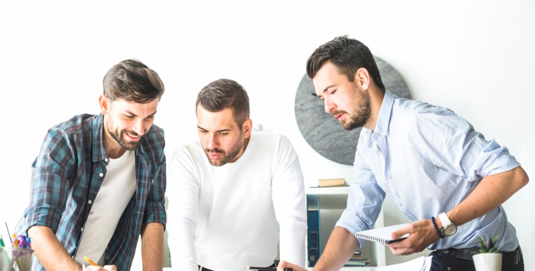 Business professionals analyzing budget spreadsheets and financial planning documents